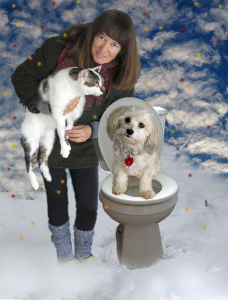 Robin Botie in Ithaca, New York poses with cat and Suki-dog Havanese and toilet in the snow.