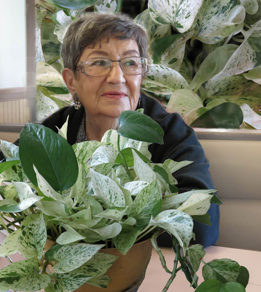 Mother of Robin Botie with dieffenbachia plant that is experiencing change and loss
