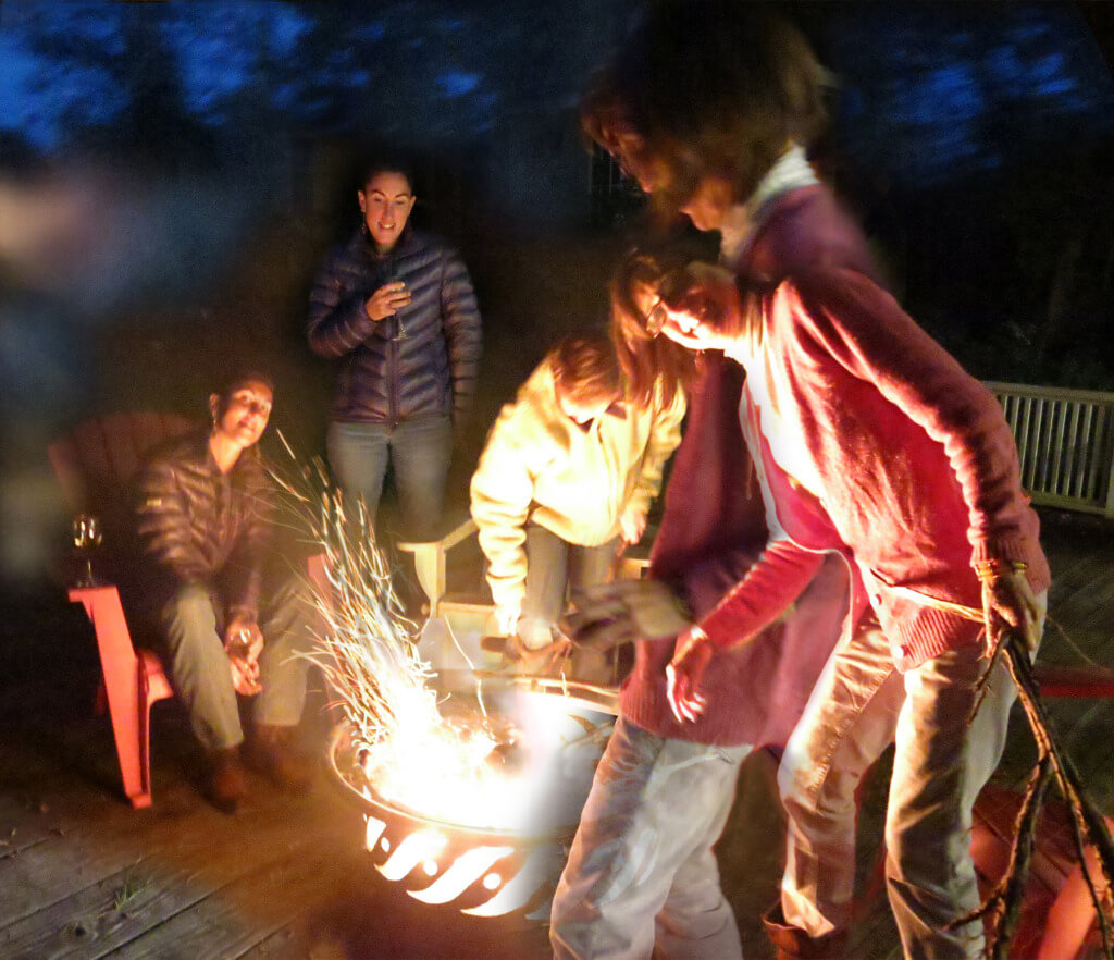 In Ithaca, New York, Robin Botie and fiends make a campfire on her deck.