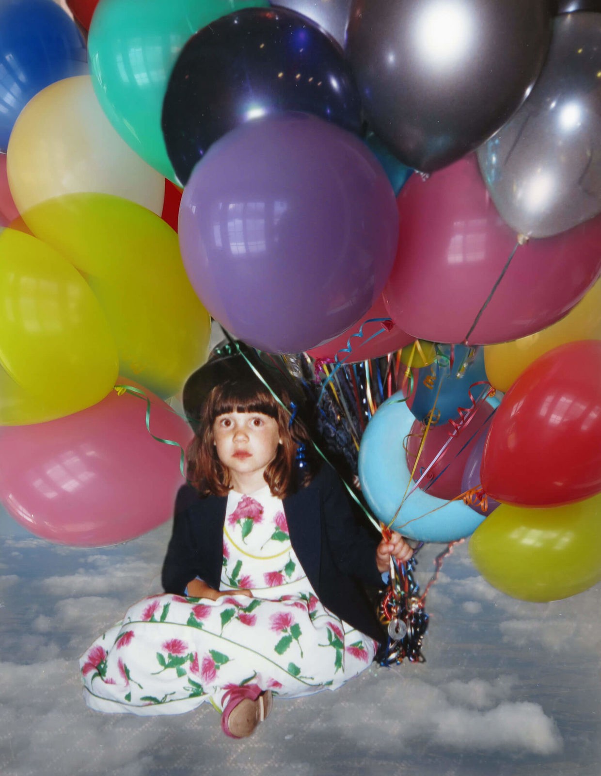 Robin Botie in Ithaca, New york, Photoshops her daughter who died of leukemia as a young girl surrounded by balloons