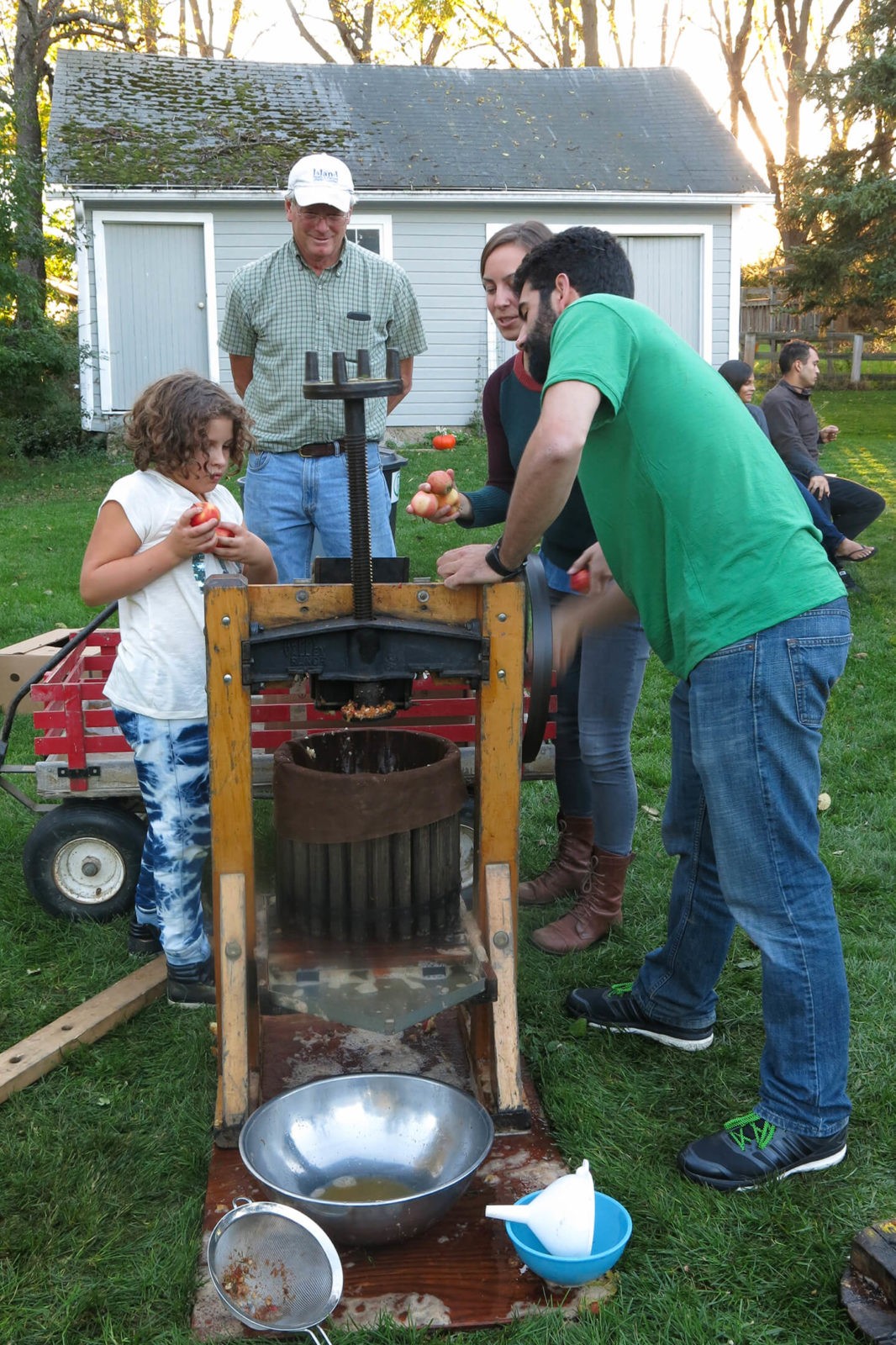 Robin Botie of Ithaca, New York, photographs an apple cider pressing party.