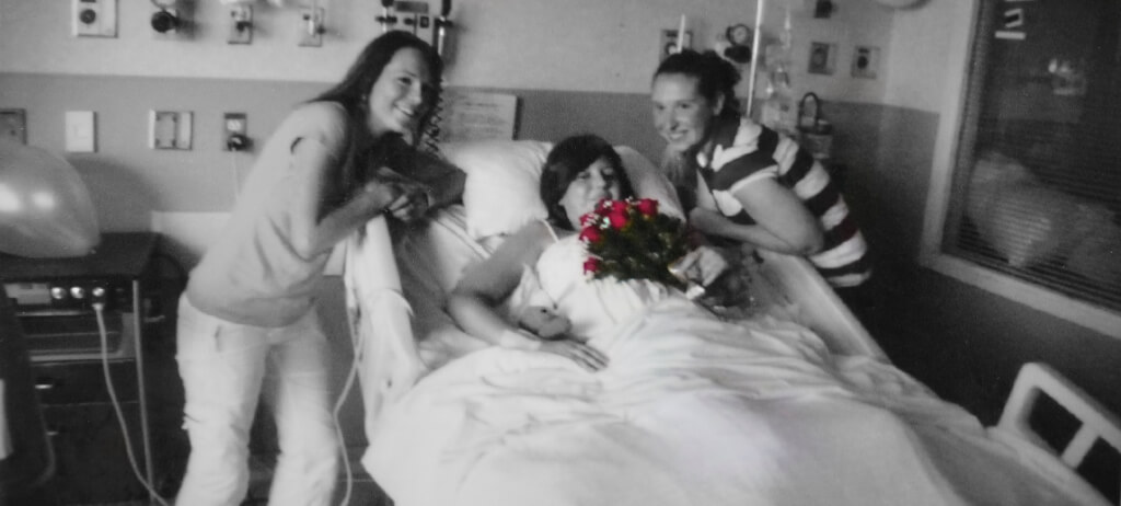 Robin Botie of ithaca, New York, restores a photograph of her daugher with two oncology nurses at Strong Memorial Hospital.