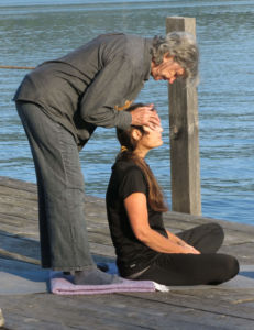 Yoga on the dock of Wiawaka Holiday House on Lake George led by Kathleen Fisk. Attended by Robin Botie of Ithaca, New York, and other bereaved mothers from all over New York.