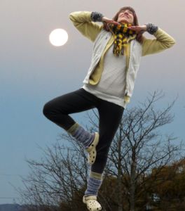 Robin Botie of ithaca, New York, tries to do the tree yoga stance in a photoshopped moonscape.